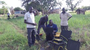 Here the computer is reading electrical charges using a generator to locate the best pools of water and their depth. Please note that this is being done in the African bush :-).