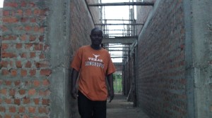 Sam in standing in the future north doorway. The breezeway runs through the entire center of the house so that the north-south winds can freely go through the whole house. Nurse Sam likes his Texas Longhorn shirt....you non Longhorn fans be kind now :-).