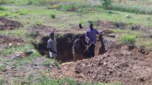 The septic tank and drain field is next to the new latrine. Our rainy weather makes for challenging digging!