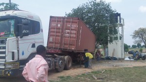 The container "almost" tipped on it's side several times in its slide off the the trailer.