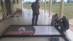 Assembling the sign on RAU's front vereanda