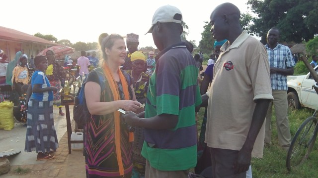 Carol sharing the gospel in a rural Yumbe District market