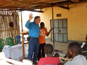 John preaching with Godfrey interpreting