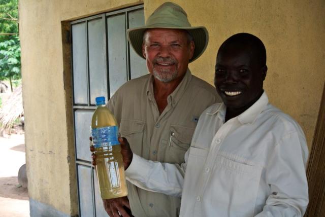 Godfrey and Obongi drinking water